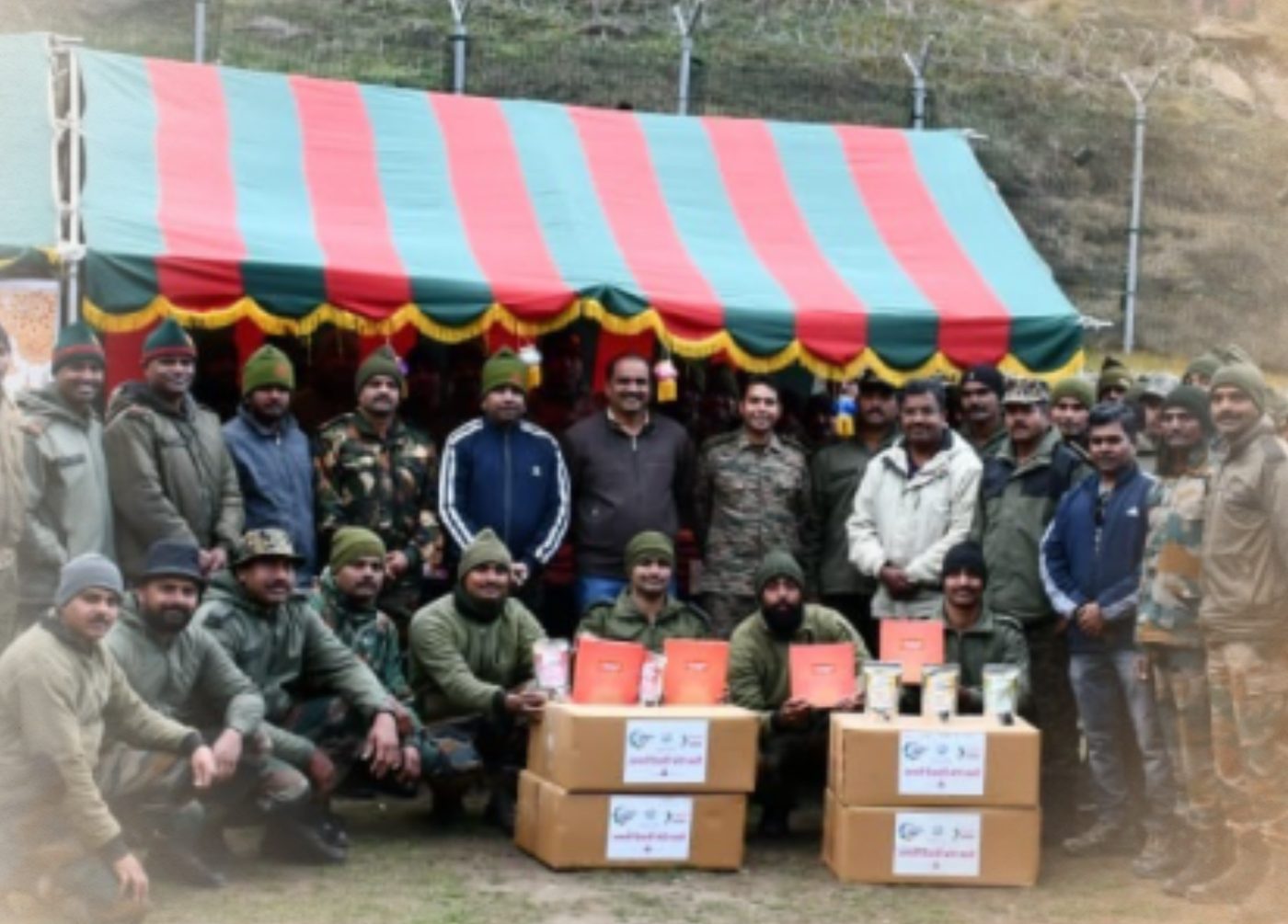 Jawans and volunteers with boxes of Diwali faral at a border post